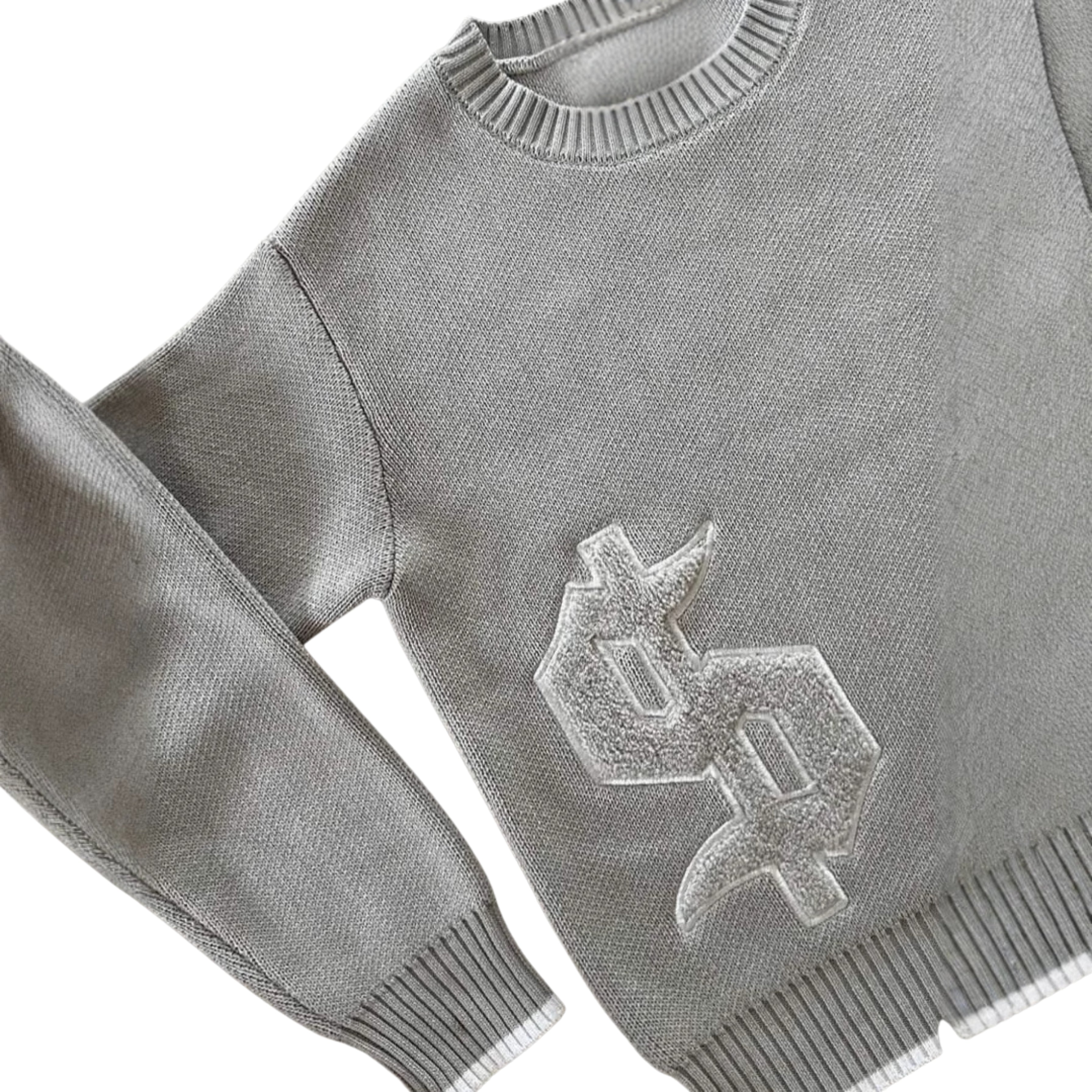 Grauer Strickpullover mit Dollarzeichen & 'Buy Happiness' Botschaft – Bequem & Stylisch