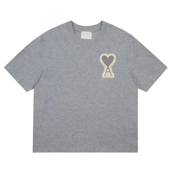 https://cdn.shopify.com/s/files/1/0901/0413/6028/files/ami-heart-tee-434653.webp?v=1743324151
